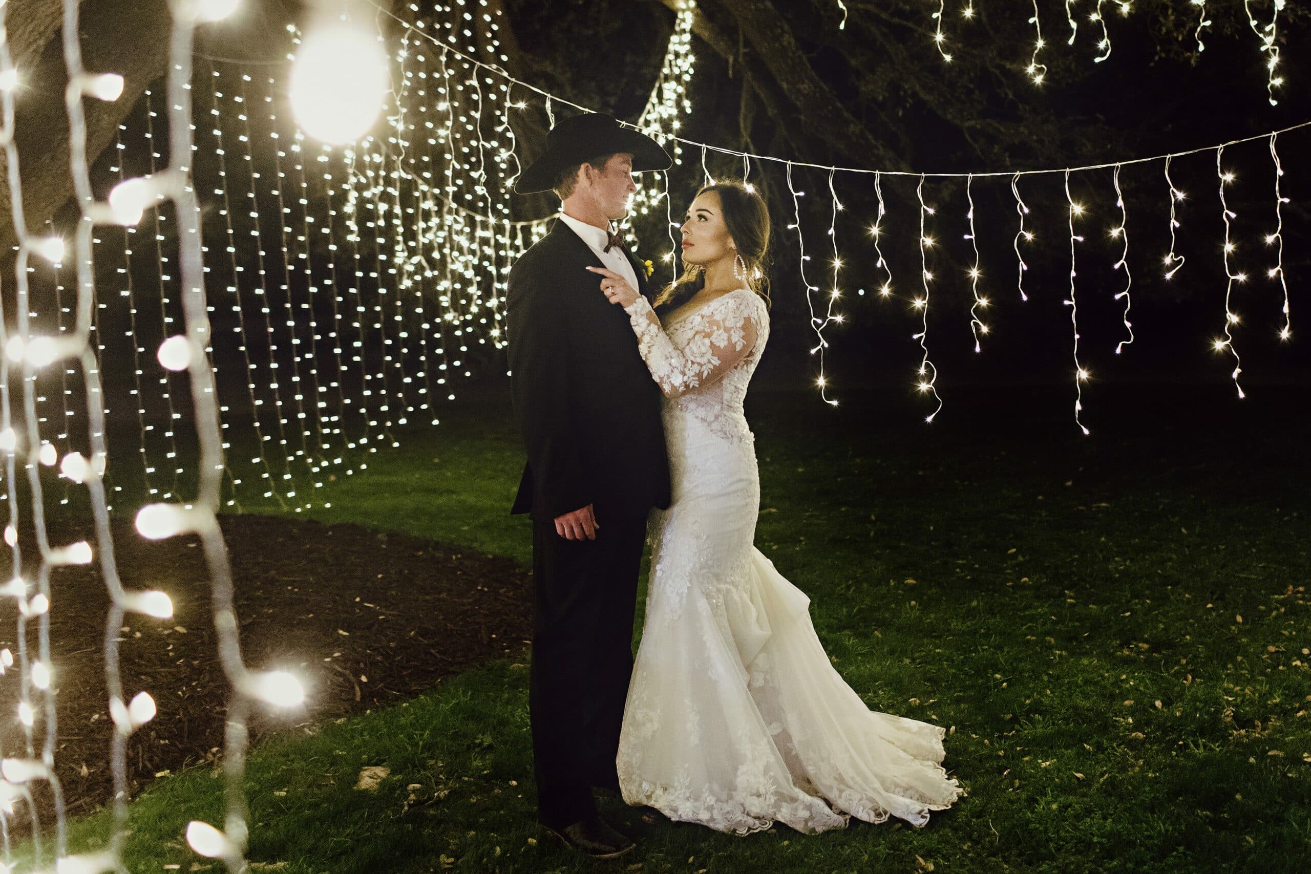 A newlywed's last dance under an oak tree at the Diamond A Ranch.