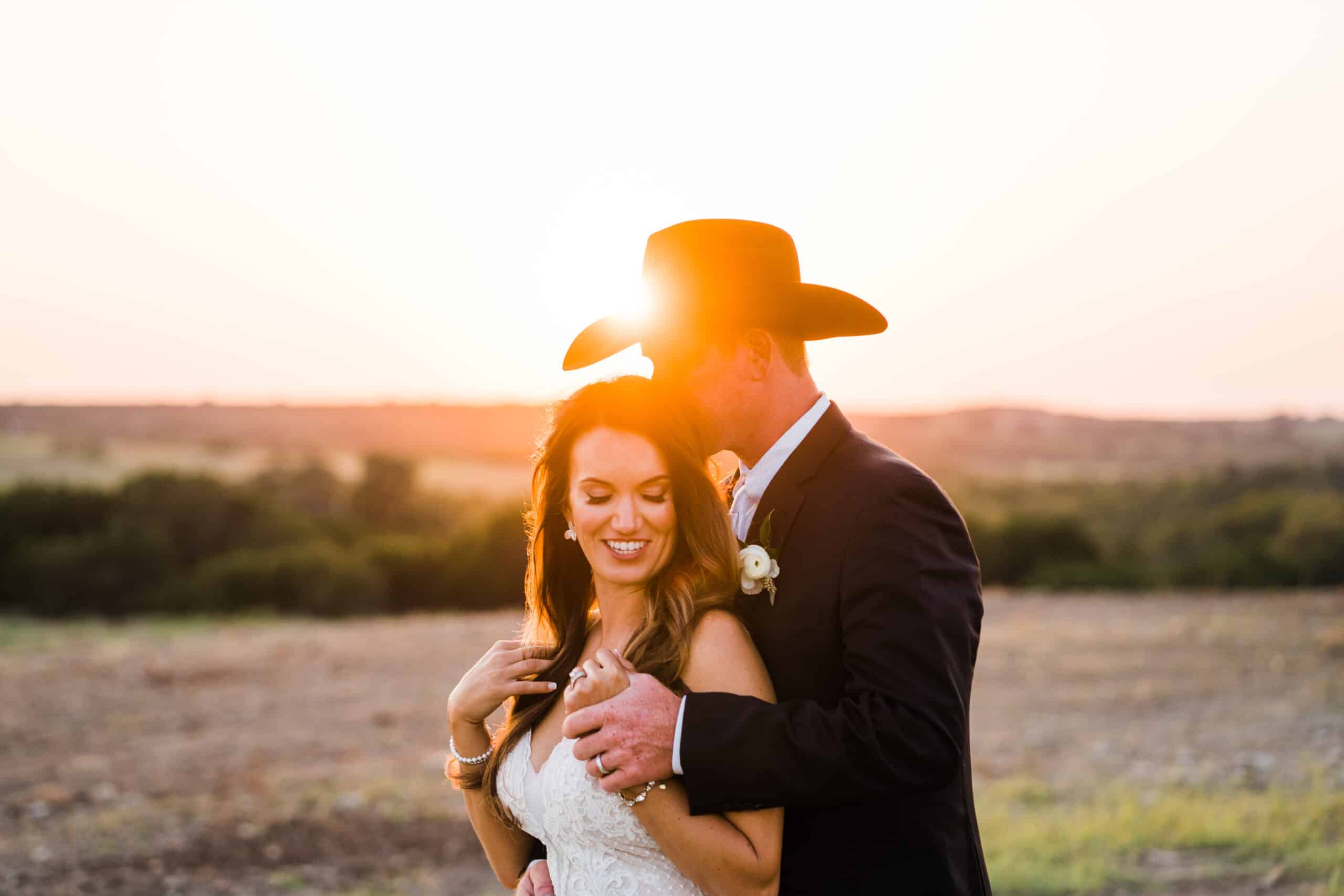 newlyweds posing at sunset in texas