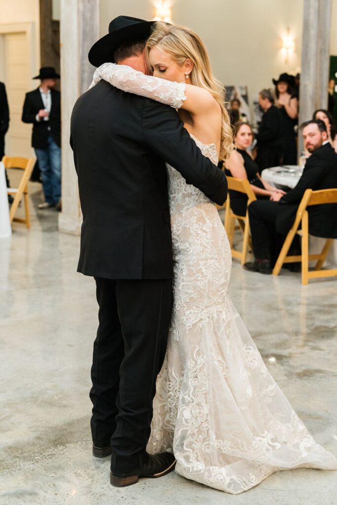 Bride dancing with her father at Texas wedding.
