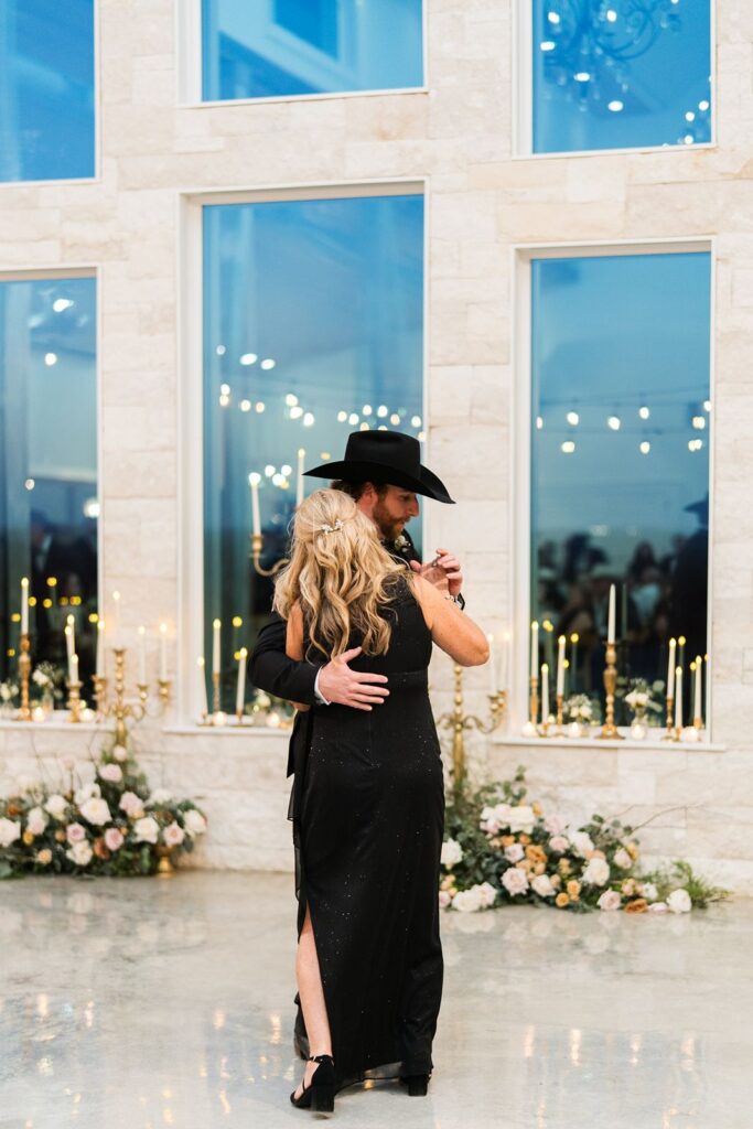 Groom dancing with his mom at Granbury TX wedding venue.