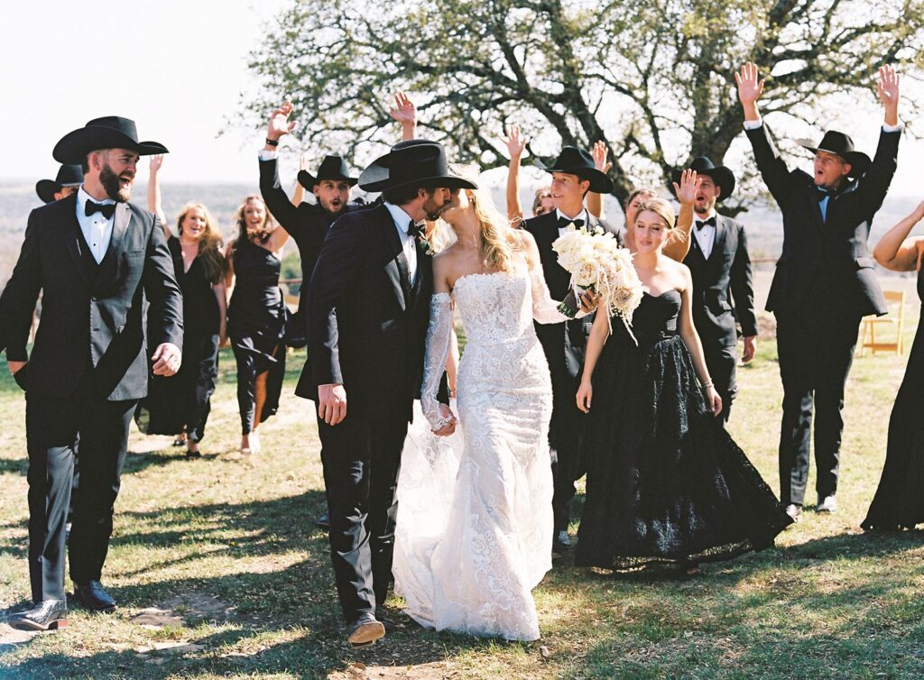 Newlyweds with wedding party at Diamond A Ranch.
