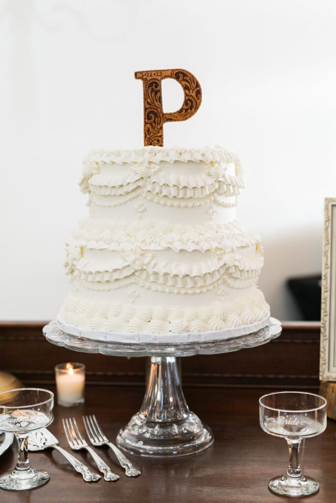 Wedding cake with a P cake topper.