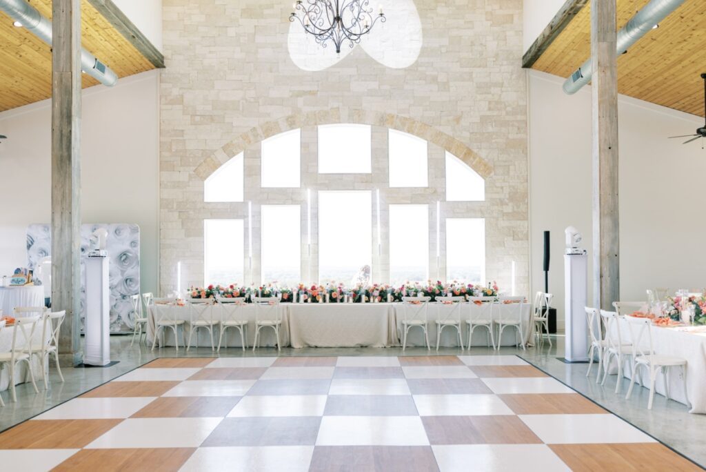 A pink and white dance floor at the Diamond A Ranch, a Weatherford wedding venu