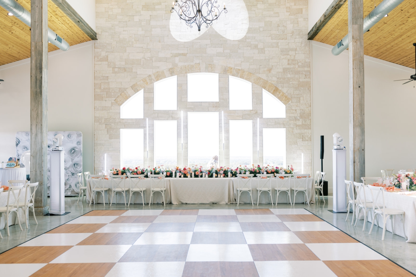 A pink and white dance floor at the Diamond A Ranch, a Weatherford wedding venu