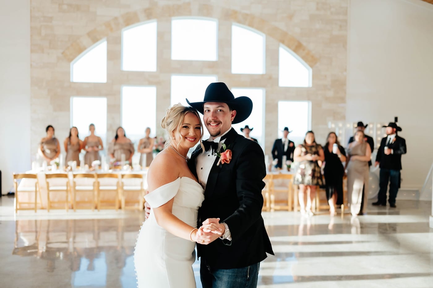 A bride and groom share a first dance during their wedding at the Diamond A Ranch