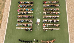 An aerial view of a bride walking down the aisle at the Diamond A Ranch