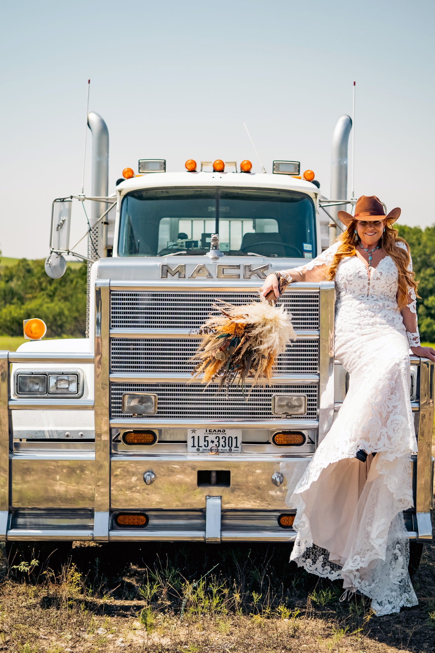 Bride in front of a Mack truck