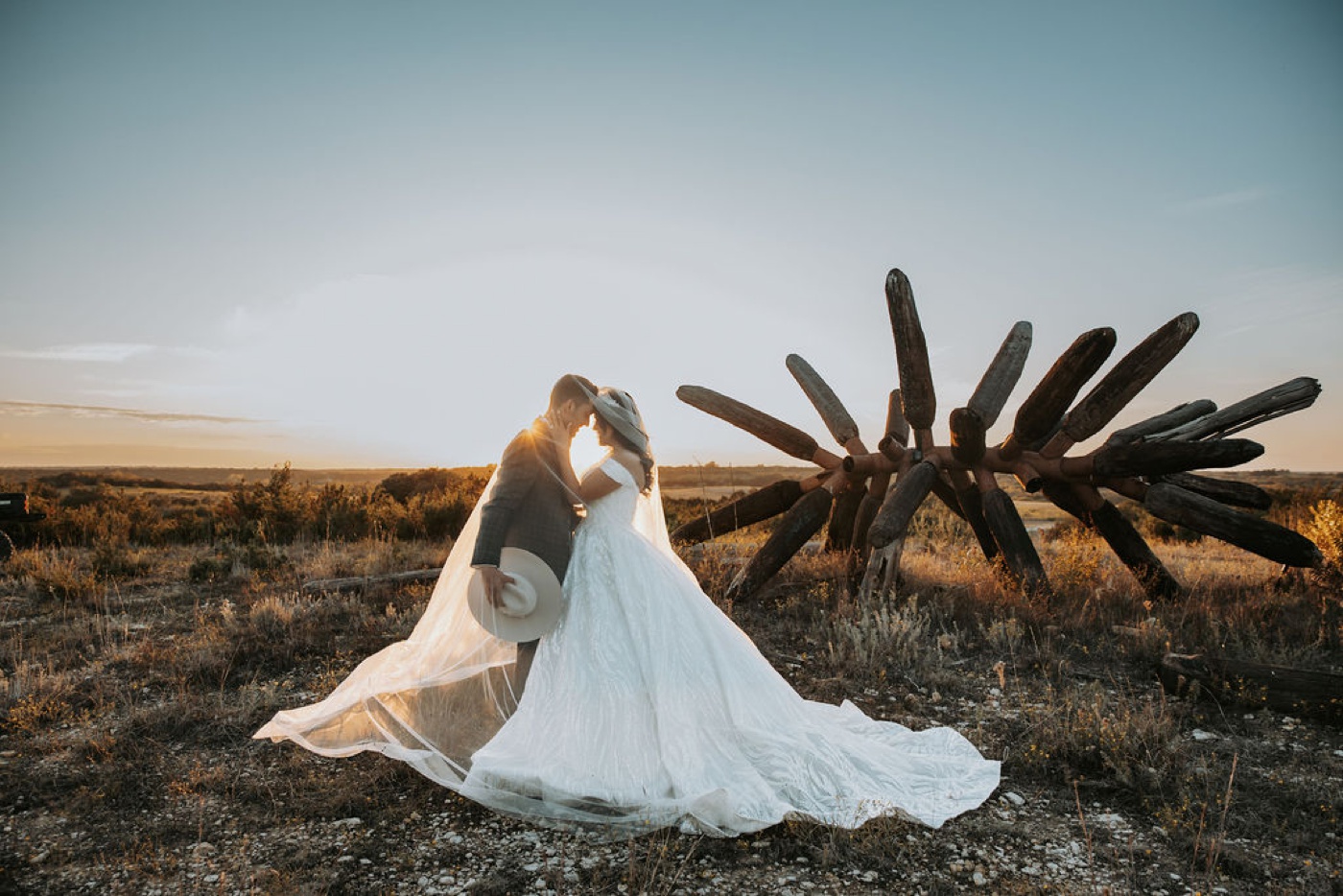 Sunset bridal portrait in front of the James Surls sculpture at Diamond A Ranch