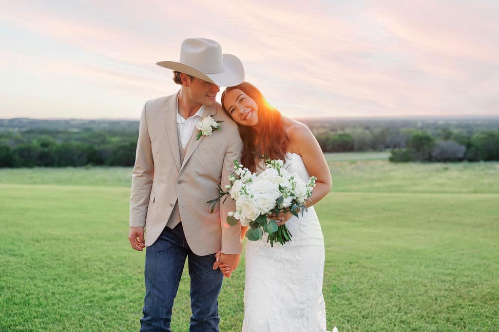 Bride and groom smile at Granbury wedding venue
