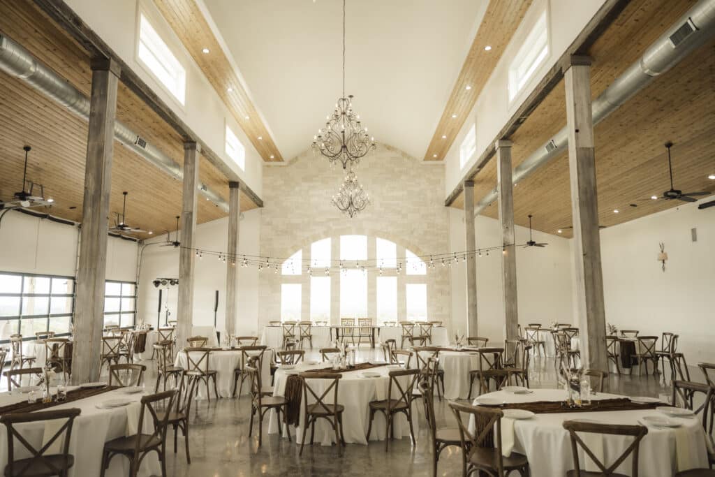 Indoor wedding venue with wall of windows